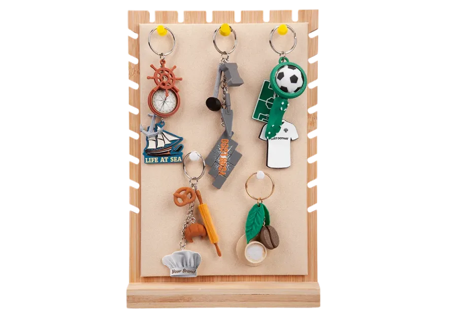 Creative 3D promotional keychains by dothat on a wooden stand